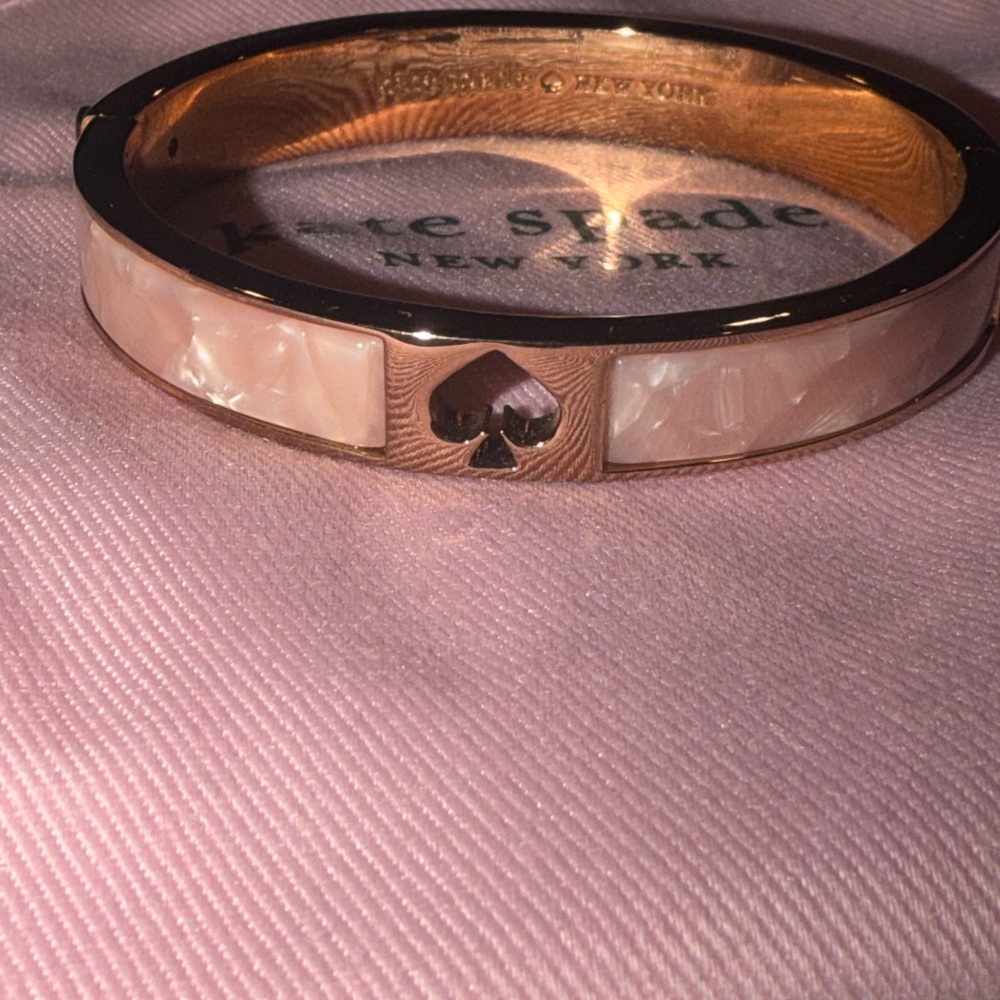 Kate Spade Hole Punch hinged bracelet in pearlescent pink and cream rose gold